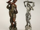 paire de figurines anciennes en bronze représentant une femme et un homme