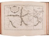 an old book with a map of the world on it