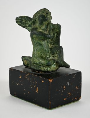an image of a statue of a monkey sitting on top of a wooden block