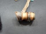 a piece of wood that has been made into a bell