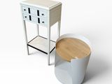 an image of a white table with a wooden top next to a trash can