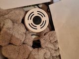 a box with a stuffed animal inside of it on a table
