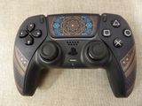 a close up of a video game controller on a table