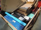 boxes of electronic equipment are stacked on top of each other in a warehouse
