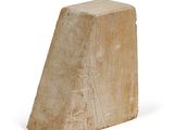 a stone block that has been placed on a white surface
