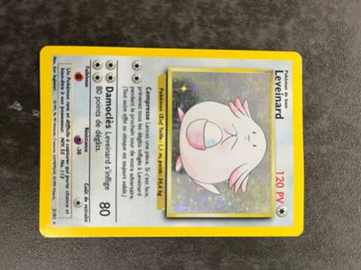 a close up of a pokemon card on a table