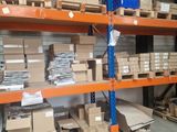 many boxes and boxes on the shelves in the warehouse