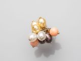 a close up of a bunch of pearls on a white surface