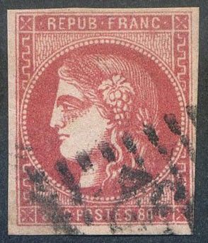 a red stamp with a woman ' s face on it