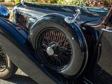 a vintage car parked on the side of the road