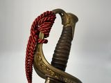 an old sword with a red rope hanging from it ' s end