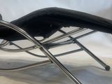 an image of a black leather chaise lounger