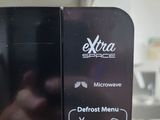 a close up of a microwave with a menu on it