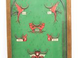 an image of a green pinball machine with red birds on it