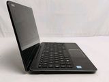 a laptop that is sitting on a white surface