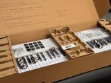 a cardboard box with a bunch of tools inside of it