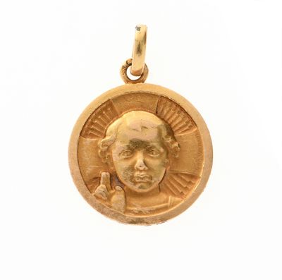 l'image d'une pièce d'or sur laquelle figure l'image d'un homme