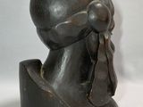 statue of a woman with a scarf on her head