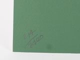 a green piece of paper with a drawing on it