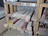a pile of pipes and pipes in a room that is under construction