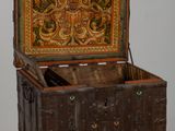 a wooden chest with a decorative design on it