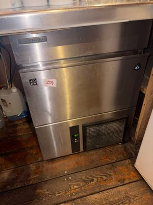 a stainless steel dishwasher in the corner of a kitchen