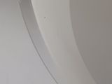 a close up of a toilet seat with the lid up