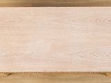 a close up of a wooden table on a wooden floor