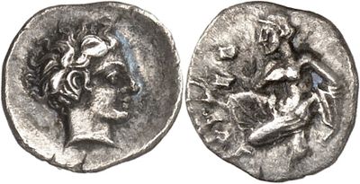 a silver coin with a woman and a man on it