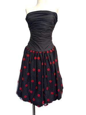 a black and red polka dot dress on a mannequin mannequin mannequin mannequin mannequin mannequin mannequin manne
