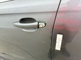 a close up of a car door handle with a sticker on it