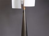 a black and white floor lamp with two lamps on top of it