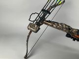 someone is holding a bow and arrow in their right hand