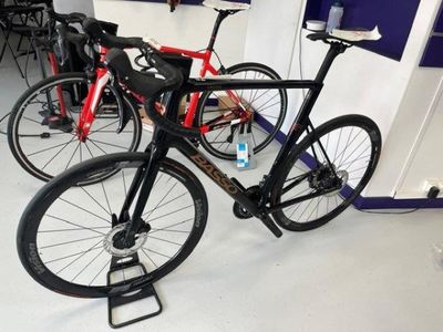 two bikes that are sitting on the floor in a room