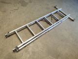a close up of a metal ladder on the ground