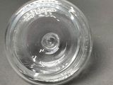 an image of a clear glass bottle on a table