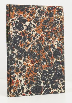 a book with a black cover and orange and white paint splattered on it