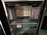 an image of a commercial ice cream machine in a kitchen