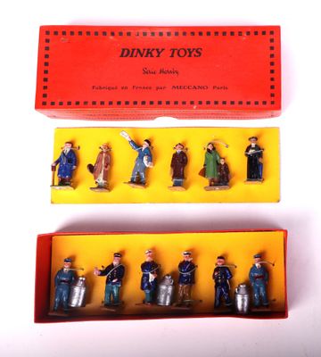 six toy figurines of people in a red box