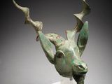 a close up of a sculpture of a deer head on a clear base