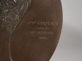 an image of a bronze statue of a man with a beard