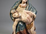 an image of a statue of a woman holding a baby