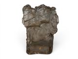 a sculpture of a rock on a white surface