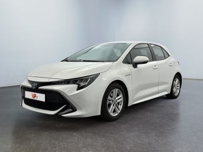 a white toyota corollion parked in a room