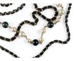 black and white beaded necklace with pearls on a white background