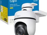 a close up of a camera with a box in the background