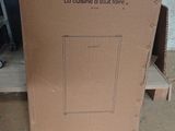 cardboard box on the floor with a picture of an oceanic logo on it