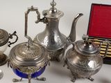 a silver tea pot and a silver tea pot and a silver tea pot and a silver tea pot and a silver tea pot and a silver tea pot