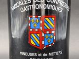 a bottle of wine with a coat of arms on it