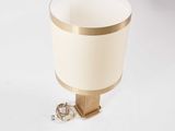 a lamp that is sitting on a table next to a key